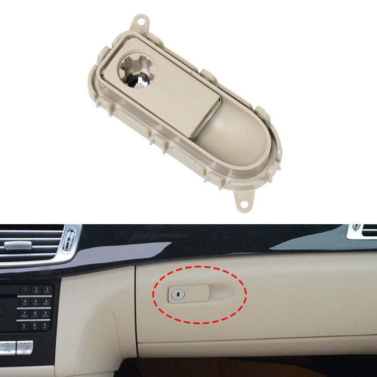 Cream glove box handle switch panel with oval button recess and mounting tabs