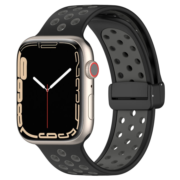 Black silicone watch band with magnetic buckle, perforated sport-style holes.