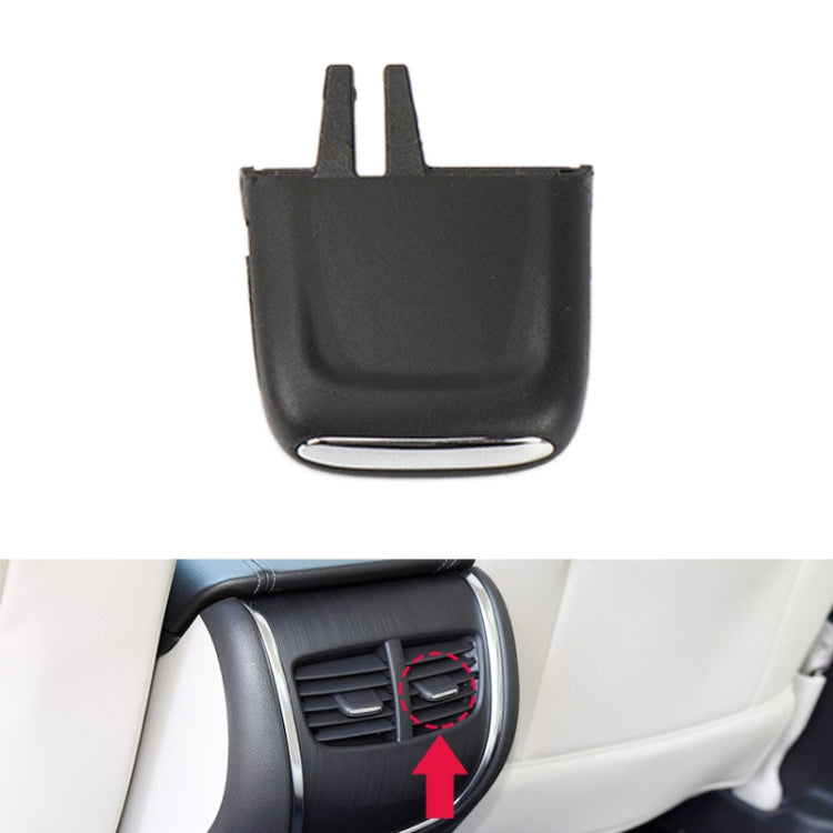 Black air outlet paddle insert installed on rear side air vent
