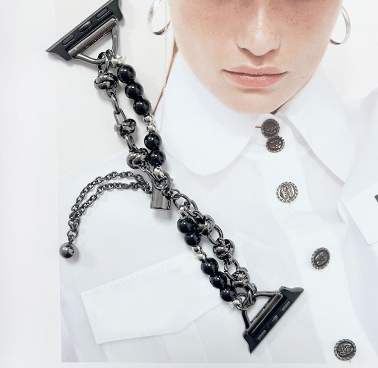 Pearl watch band bracelet with black beads, silver chain links, and triangular clasp