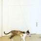 Retractable cat teaser stick with mouse plush at floor level on a hanging cord