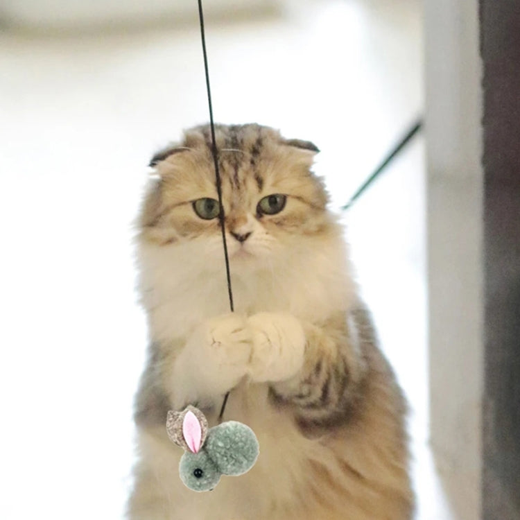 Retractable cat teaser stick with green-blue mouse plush hanging in front of cat