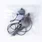 Retractable cat teaser stick with gray furry dangling toy and black cord