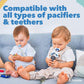 Two toddlers with pacifiers attached to clip straps, one with a blue dummy