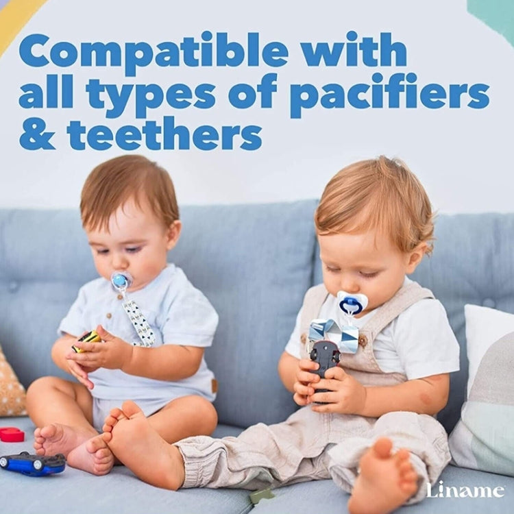 Two toddlers with pacifiers attached to clip straps, one with a blue dummy