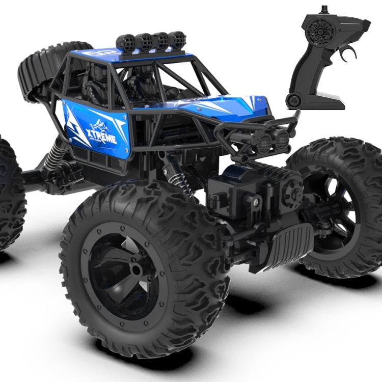 Blue and black RC climbing truck with large knobby tires and remote controller