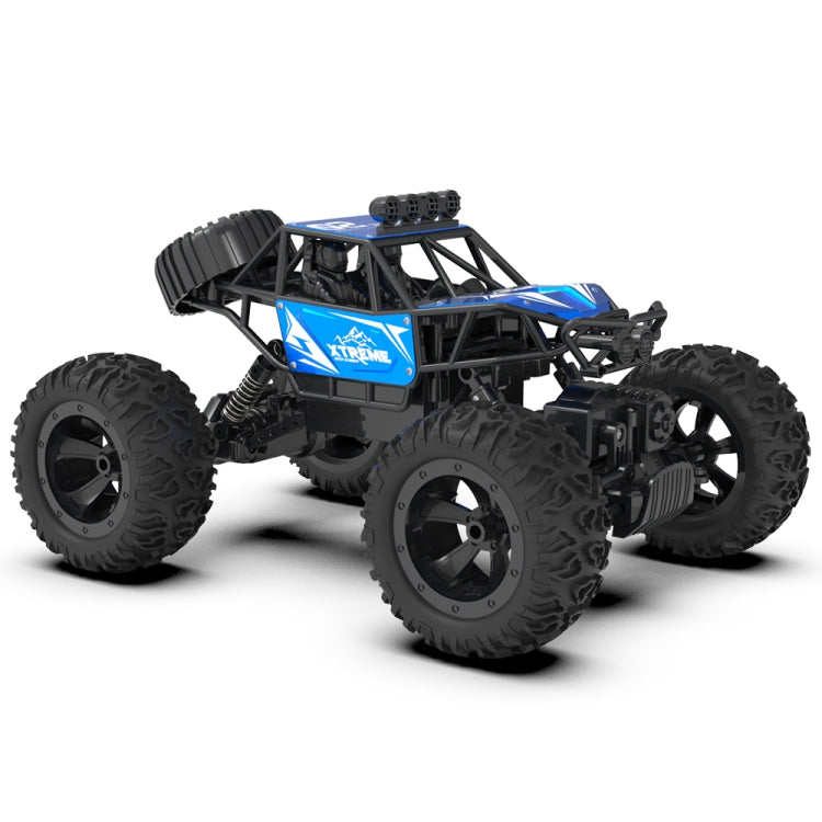 Blue and black RC climbing truck with exposed suspension and oversized off-road tires