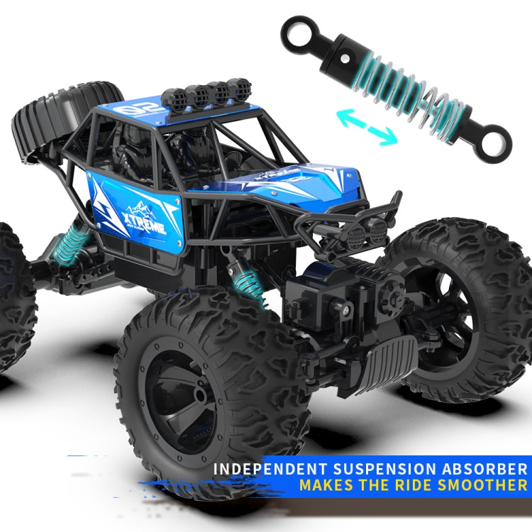 Blue and black RC climbing truck with coil shock absorbers and front grip bumper