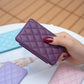 Purple diamond-quilt phone card holder back sticker held in hand