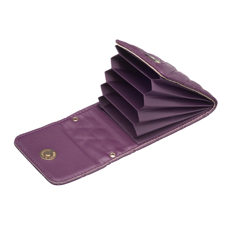 Opened purple quilted card holder wallet with fold-out slots and gold snap