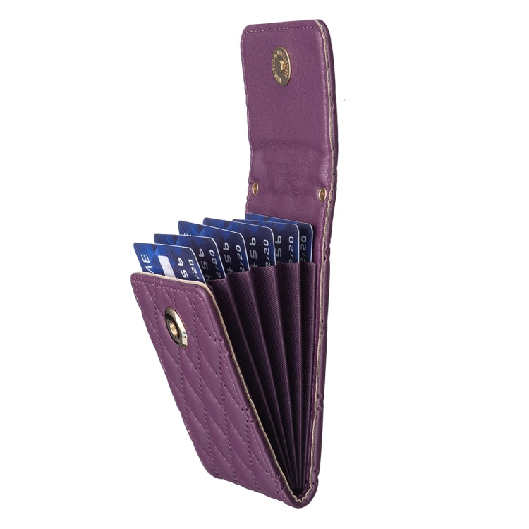 Purple quilted vertical card holder wallet opened, showing card slots and snap closure