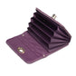 Purple quilted card bag open view with gold-tone snap buckle and card slots