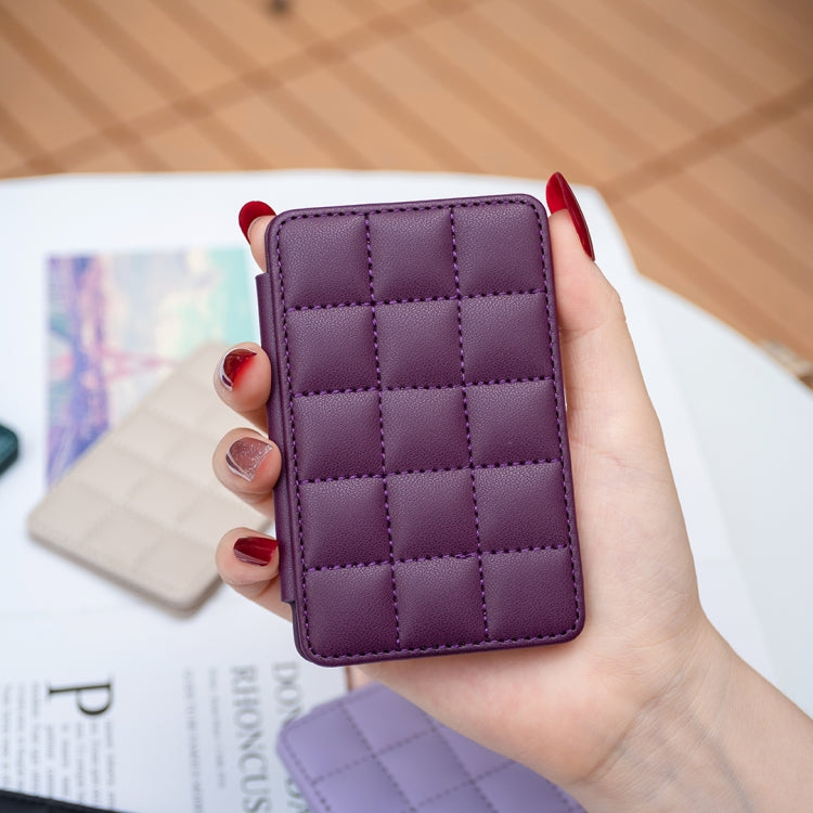 Purple grid card bag back sticker held in hand; stitched squares design.