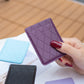 Purple diamond lattice card holder sticker held in hand; stitched phone-back style.