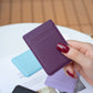 Purple card holder back sticker with top pocket, shown with extra cards