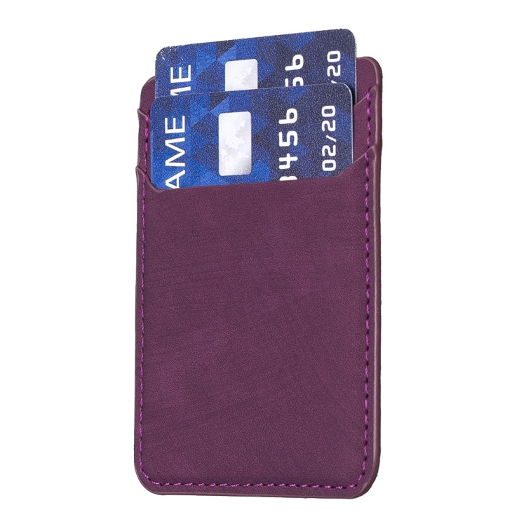 Dark purple phone card holder with top flap holding two cards inside