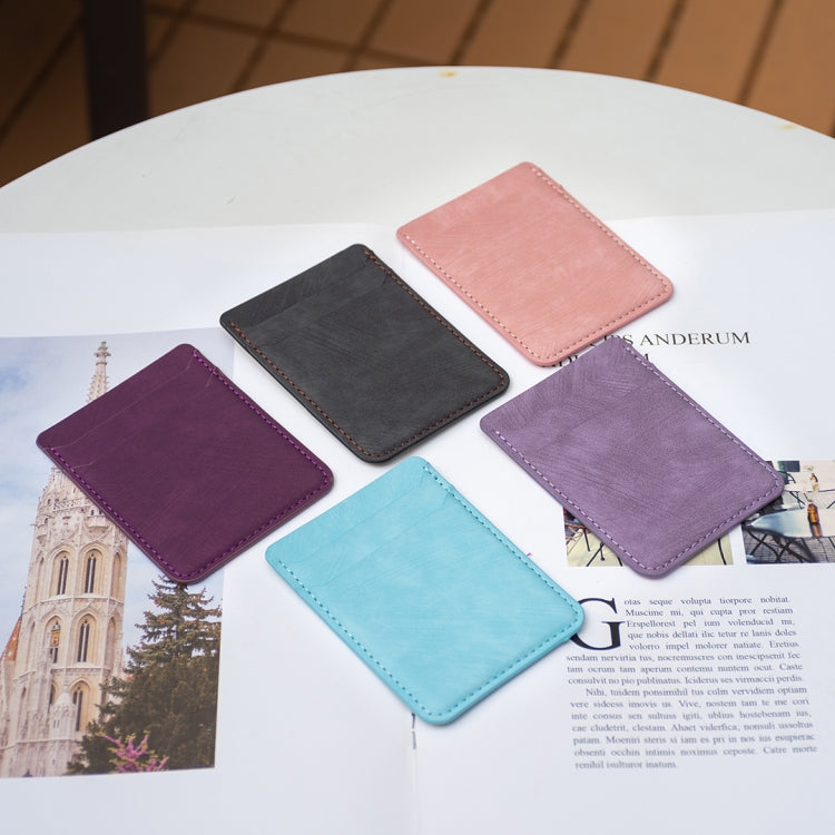 Assorted phone card holders in dark purple, black, light pink, lavender, and light blue