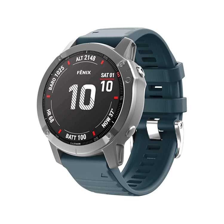 Navy silicone watch band with silver steel buckle on a round smartwatch