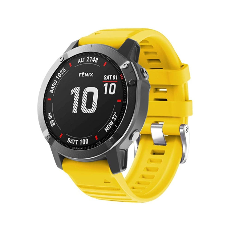 Silicone watch band with steel buckle, bright yellow strap and watch dial visible
