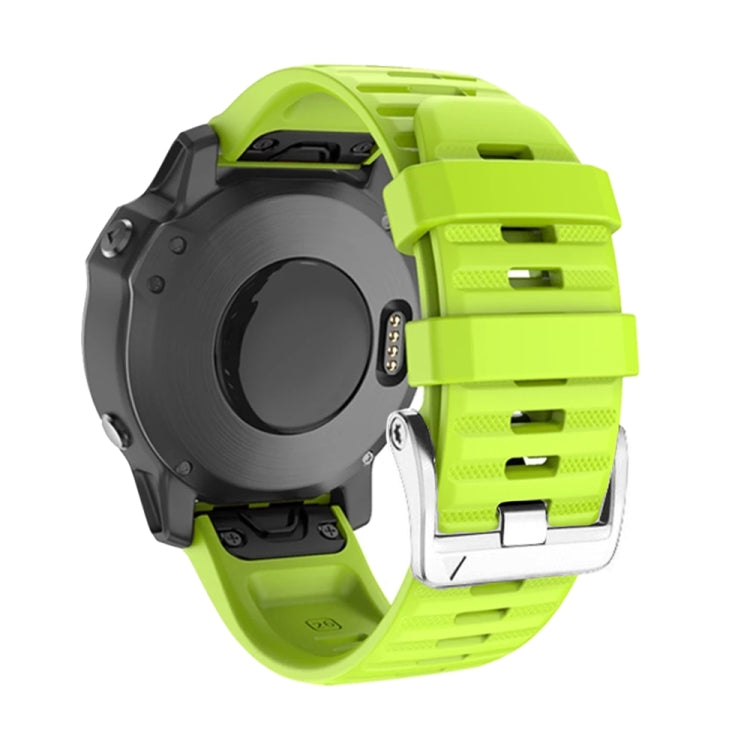 Silicone watch band with steel buckle, lime green strap with watch dial visible