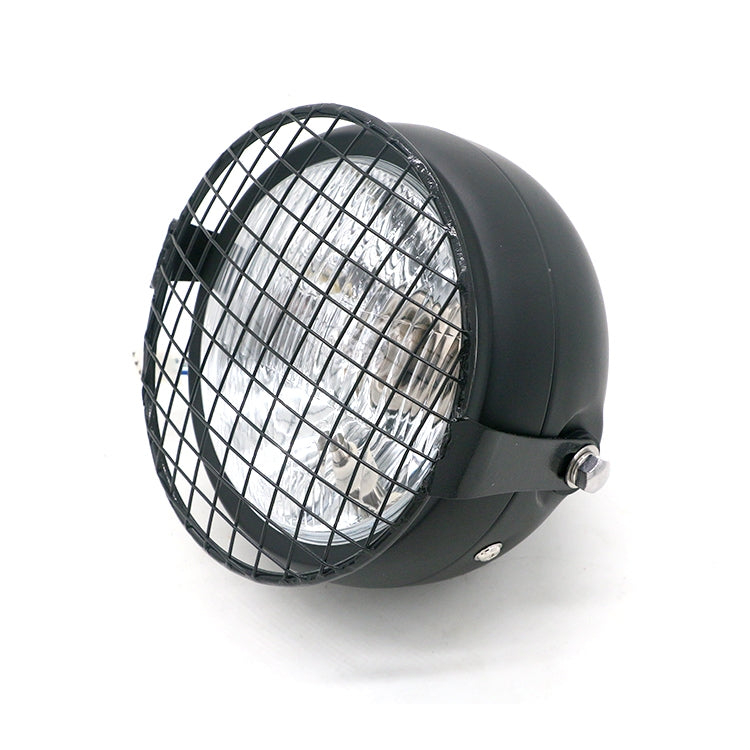 Motorcycle retro LED headlight with black housing, wire mesh guard, side mount