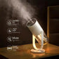 White wireless humidifier on tabletop stand with warm glow, releasing mist.