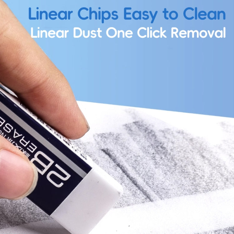 2B eraser wiping graphite smudges from paper surface