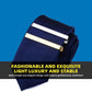 Gold tie clip holding a navy dress tie