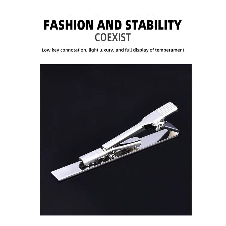 Silver tie clip with rectangular bar and spring clamp, close-up