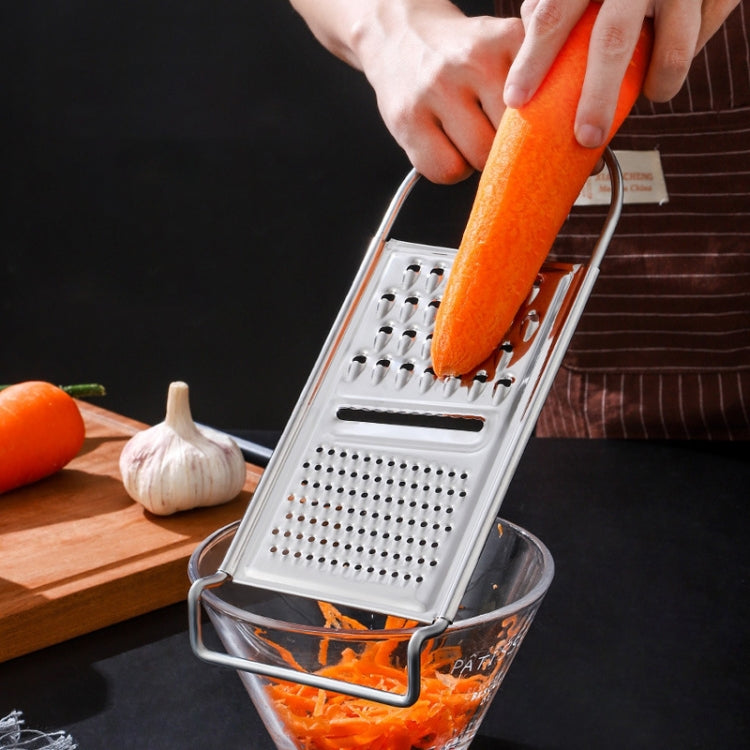 Stainless steel box grater with orange handle, multiple cutting surfaces