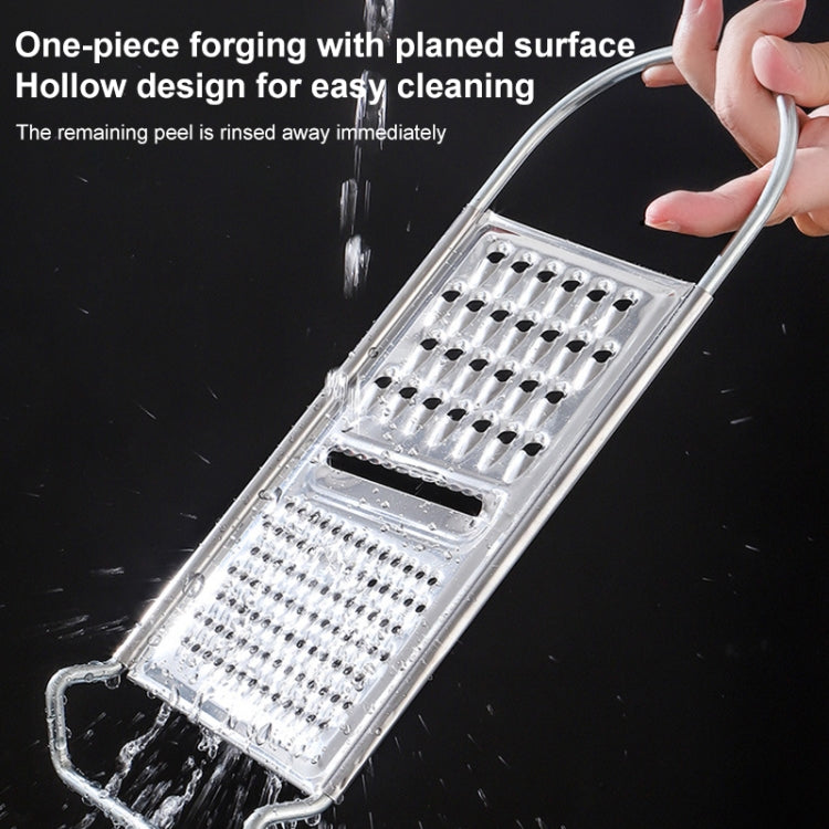 Stainless steel potato grater with perforated holes, held over a bowl