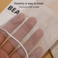 Hand holding a fine mesh foaming net pouch, pale beige color