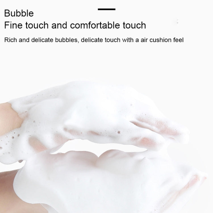 White facial cleansing foam on fingertips after using a foaming net