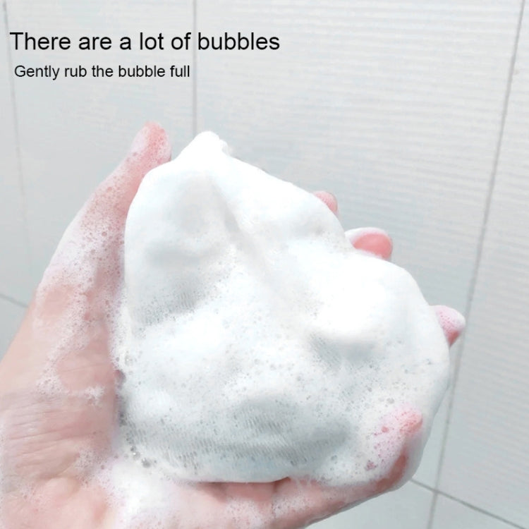 Thick white soap bubbles lathered in hand for gentle cleansing