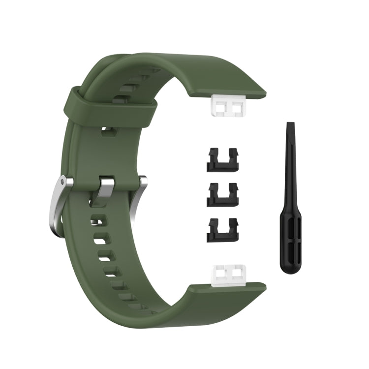 Silicone watch band with silver steel buckle, dark green; spare clasp parts shown