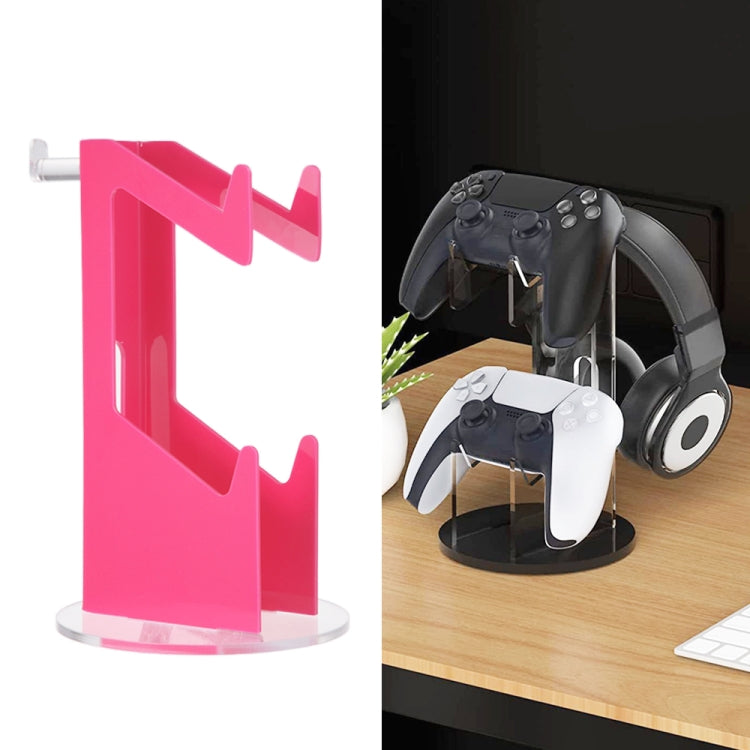 Desktop display stand with pink translucent holder, supports headset and game controllers