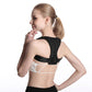 Black posture correction belt with shoulder strap worn over a white sports bra