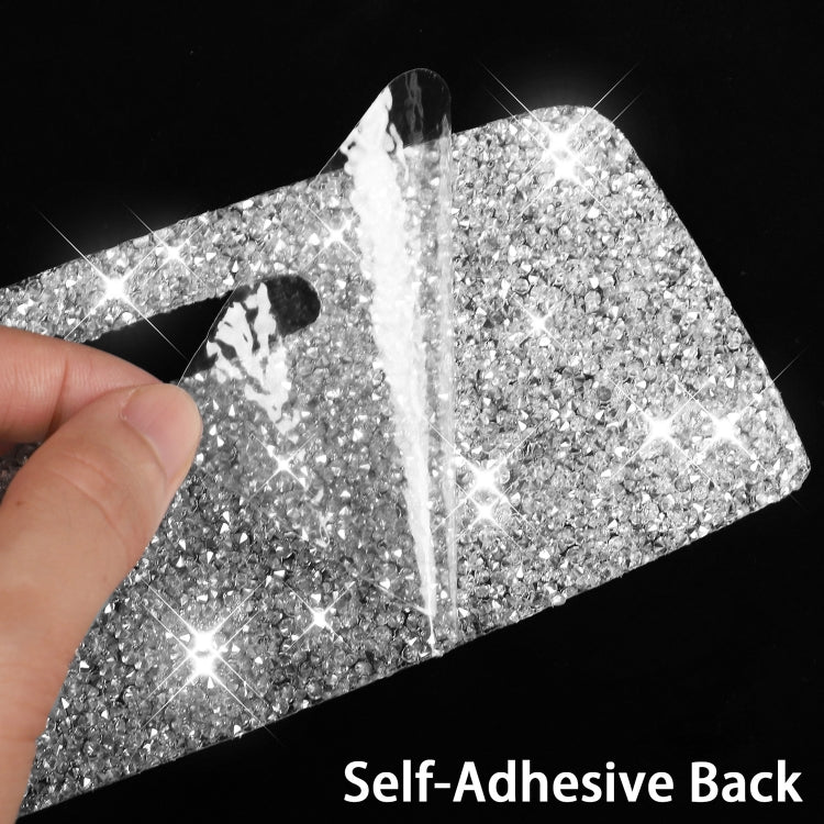Two diamond glitter self-adhesive sticker pieces held in hand