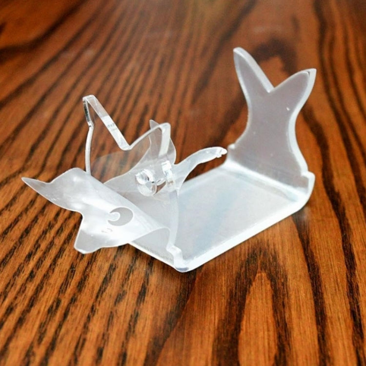 Clear fishing lure display stand with two-prong supports and treble-hook holder