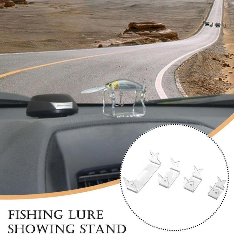 Small clear fishing lure showing stand on dashboard surface with hook loops