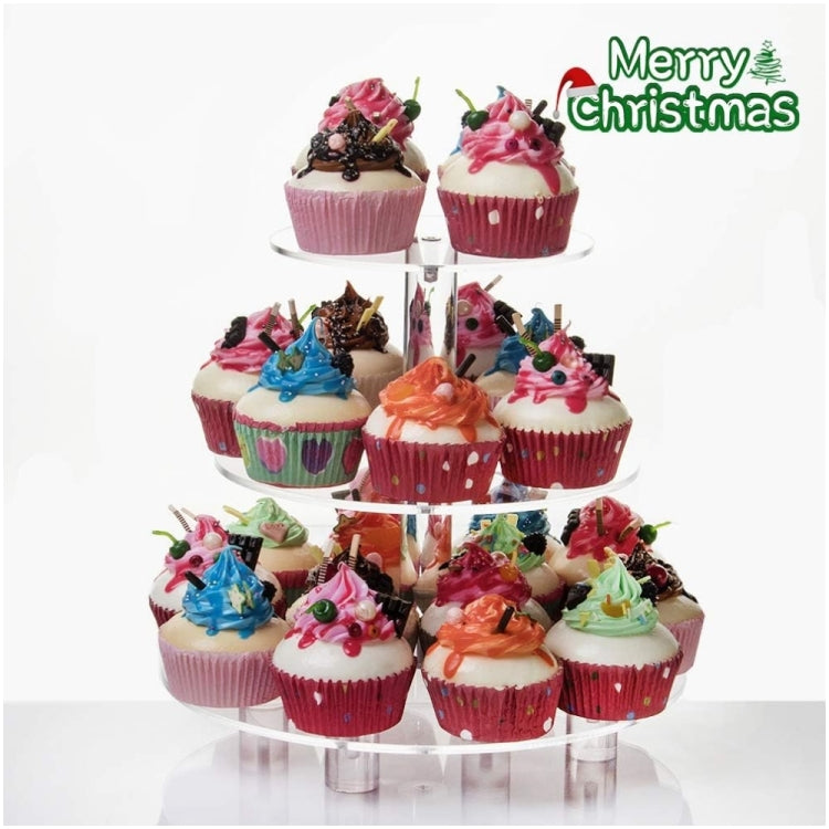 Three-tier clear acrylic cupcake stand holding decorated cupcakes