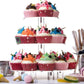 Three-tier clear acrylic cupcake stand with cupcakes on all three round tiers