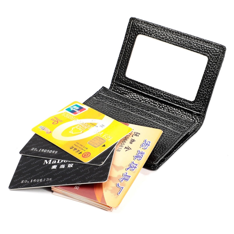 Black leather RFID card holder with open card slots, holding multiple cards