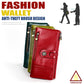 Red leather multi-pocket wallet with front strap and chain zip pull, angled on display.