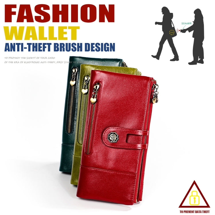Red leather multi-pocket wallet with front strap and chain zip pull, angled on display.