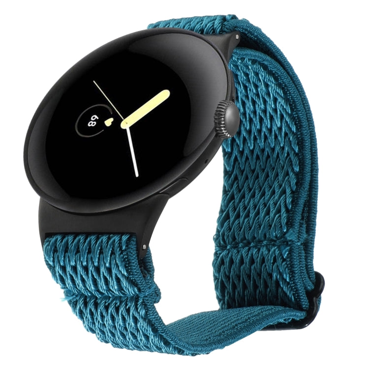 Wave braided nylon watch band in teal blue, with metal clasp and zigzag knit texture.