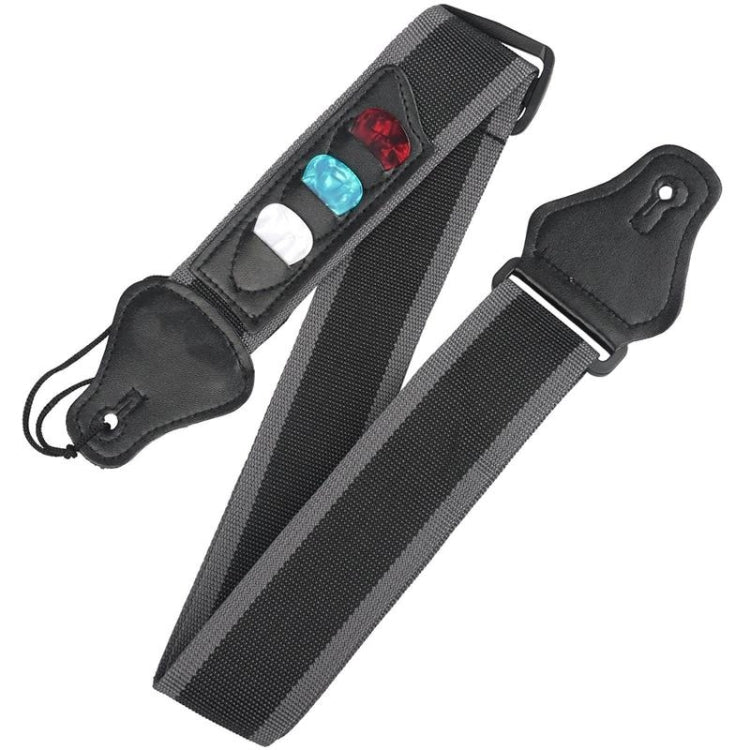 Black guitar strap with three pick holders showing red, blue, and white picks