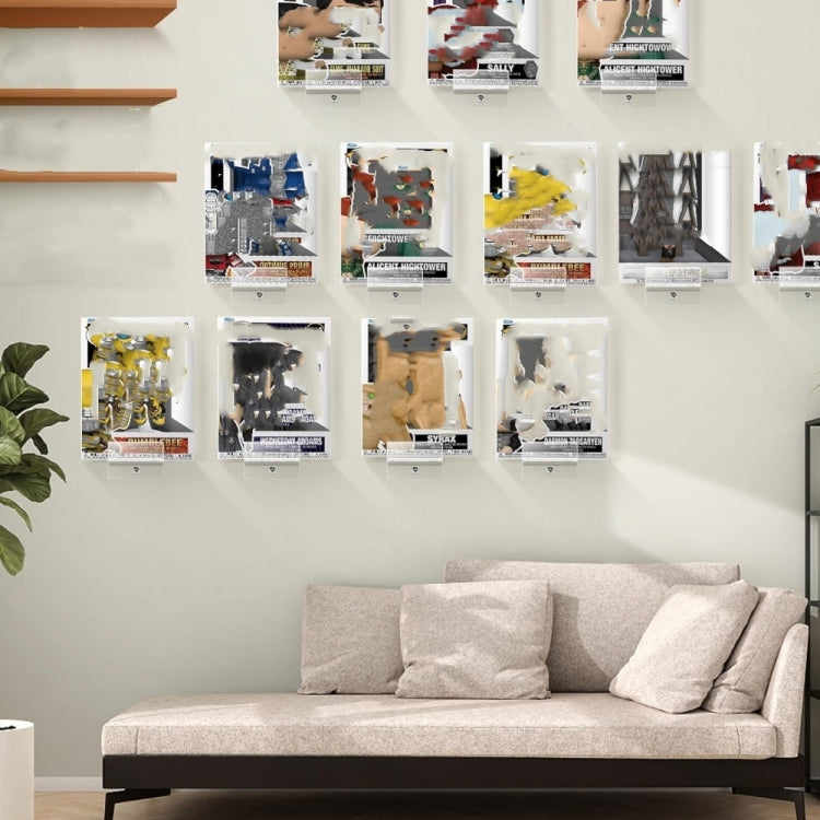 Multiple clear acrylic wall display brackets mounted in a grid for collectible boxes