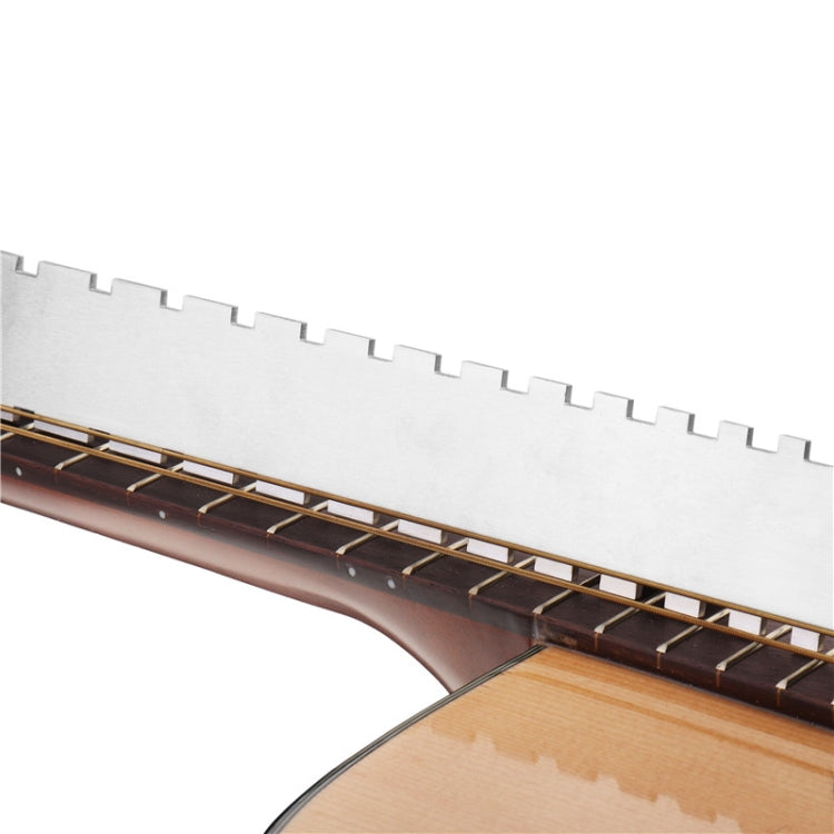 Guitar neck flat measuring ruler positioned along the fretboard