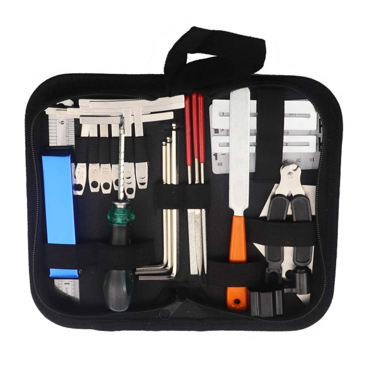 Guitar string changing tool set in zippered black storage case with assorted tools